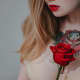 Red rose chest tattoo