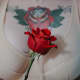 Old-school red rose chest tattoo
