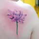 Realistic lotus blossom tattoo