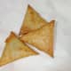 Transfer the cooked samosas to an absorbent paper.