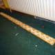 Using no-nails adhesive to glue the skirting boards to the wall.