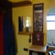 Mirrors refitted, one above a small vanity unit, and the other above the replacement brush rack.