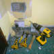 Drill, chisels and mallet to make hole in brickwork for recessed socket.