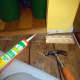 Gluing a small section of skirting into place.