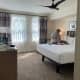 The master suite has a kingsized bed.