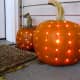 use a drill to make a polka dotted carved pumpkin.