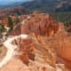 A bright path winds through the vivid red rocks!