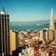 The tall pyramidal-shaped building is called the Transamerica Pyramid and is an iconic building in San Francisco. 