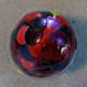 The pink tack is at the apex of the egg, but is being held down by the tacks around it.