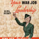 Girl Scout leader beckoning. In background, photo of hundreds of girl scouts Date between 1941 and 1945 Source USGov Author w:United States Office of War Information