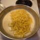 When the pasta is drained added it directly to the sauce. I do not rinse my pasta in cold water after I drain it. I feel this helps the same soak into the noodles better.