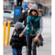 Sarah Jessica Parker sports lots of layers to keep the cold out! The green jacket and matching scarf gives her simple outfit a huge boost.