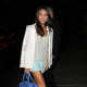 Layer with soft colors for spring and summer. Jamie Chung in mint shorts and a white blazer.