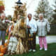 My uncle, mother, and aunt, standing by a fall decoration.