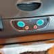 A view of manual controls, sensor, and switch used to prevent a dog from opening the trash can lid