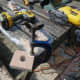 Holes cut in the end fittings to support the wooden clothes rail.
