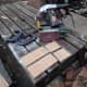 Sections of 12mm (1/2 inch) plywood cut and sanded for making the end fittings of the clothes rail and shoe rack.