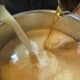 Pour the half and half and Madeira into the pan with the beef broth.