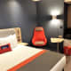 The suitcase storage area and hanging space are off the main bedroom.