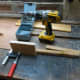 Gluing and screwing together the speaker platform and cupboard frame brace.