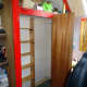 Bookcase and clothes rail fitted in place.