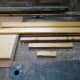 The pieces of scrap wood selected to use for fitting the speakers into the wardrobe.