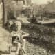 My mother is riding her tricycle with Jiggs, the family pet that could always smell hidden chocolate in the house.