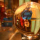 The author's son stands behind a crystal ball, and appears upside down through the crystal.