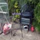 Originally, one of the chairs was stored in teh gap by the greenhouse, blocking access to the side of the greenhouse.  Now with the BBQ folding table made, both chairs can be stored together by the BBQ. 