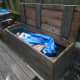 Compost bin lid modified for added strength on the leading edge.