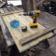 Using a couple of battens of wood, made from salvaged decking, as cross supports for the table top.