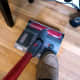 Pressing against the foot pedal will release the mop set from the soft roller brush