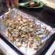 Step Ten: Pour your potato chunks onto your prepared cookie sheet