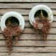 Try making a pot holder of old tires painted over, planted, and hung onto the wall.