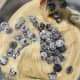 Add the blueberries into the mixture and stir to combine. Set aside.