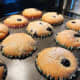 After 28 minutes, the blueberry muffins are baked. 