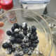 In a separate bowl, add a little flour to the blueberries and give them a toss.