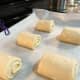 Place the rolled dough seam-side down on a parchment-lined baking tray and let them rise for 1 hour or more.