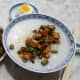 Serving suggestion for mixed stir-fry with tai tow choi: congee with a salted duck egg