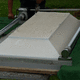 The top has been placed on the liner and is now ready to be lowered.
