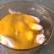 Curry sauce is poured over chicken wings
