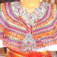 The distinctive coloured embroidery around the neckline of a traditional Kabyle dress.