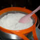 Sieving flour and baking powder.