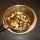 Mincemeat is stirred thorugh apples and sultanas