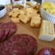 Play with organization and chaos. The crackers and meat are in neat stacks. The cheese cubes are grouped together, but they're not as neat.