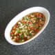 Vegetable mix is scattered over the rice and stock