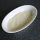 Rice is spread evenly over the base of an ovenproof dish
