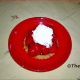Strawberry Tartlet with whipped double cream. Ready to be eaten.
