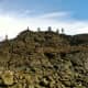 Filipino tourists climbing on top of the left side of Laswitan rock formations before they were discovered by the administration.