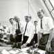 Charles W. Mathews, von Braun, George Mueller, and Lt.-Gen. Samuel C. Phillips in the Launch Control Center following the successful Apollo 11 liftoff on July 16, 1969.